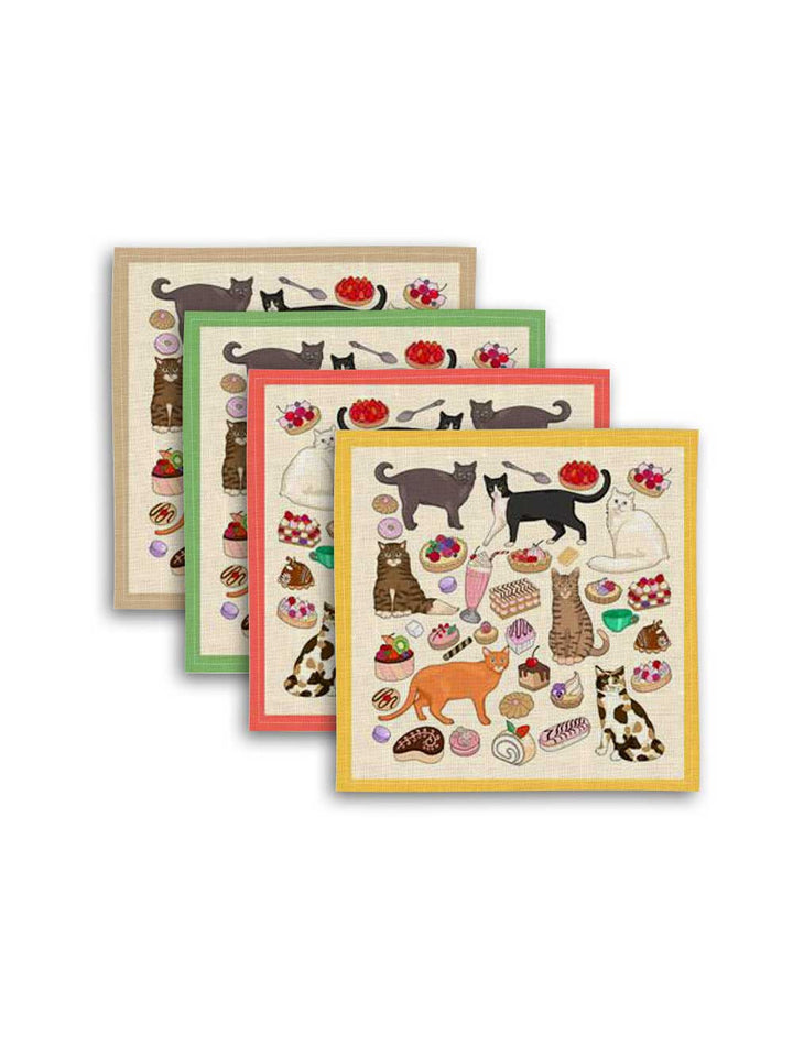 Avenida Home x Karen Mabon Cats Café linen napkin set with four napkins in different border colours featuring illustrated cats, pastries and desserts